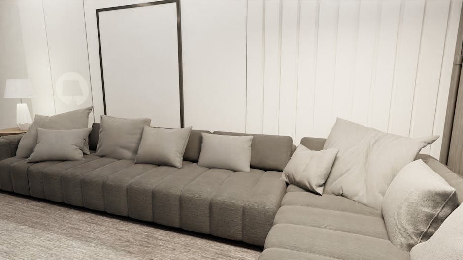 A large, red leather sofa with visible creases and textured surface is positioned upside down, leaning against a rough stone wall beside a narrow outdoor pathway. The sofa's upholstery appears slightl